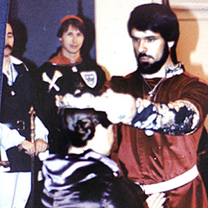 Conrad in the background at the Coronation of Jason II and Natalya II