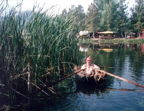 The Coracle: Glennatiegh demonstrates the construction of this simple boat. There will be several coracles on Loch Prado during the war, and they will be building one at the event from the ground up. Great Western War 1997