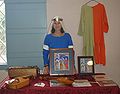 Demo display showing costume, illumination,and musical composition based upon a 13th C Illumination of a musician(Morgan Bible)and instruments that are performed on(hurdy gurdy, rebec, fiddle) - this demo was during the reign as Palatine Baroness of Western Seas 2011