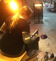 In the shop, creating a glass goblet