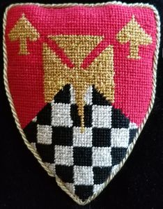 Augustine von Freiburg Per chevron gules and checky sable and argent, a cross formy fitchy and in chief 2 card-piques Or. Sir Augustine was elevated to the Order of the Chivalry on October 6, 2007 by Drogo and Iðuna, King and Queen of Caid. On September 5, 2010 he was elevated to the Order of the Pelican by Conrad and Eleanor, King and Queen of Caid.