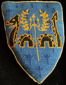 The Barony of Calafia Azure, a sea serpent ondoyant-emergent sable fimbriated Or, overall a trident with a laurel wreath entwined in its tines Or Giles served as Golden Trident during part of the tenure of Talanque.