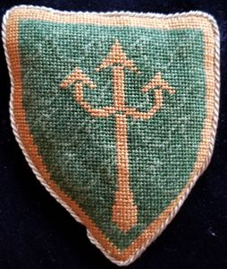 Conor de Carlton Vert, a trident and a bordure Or. Master Conor was added to the Order of the Pelican by Patrick I & Kara I on June 5, AS XLV (2010).