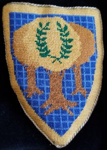 The Barony of Gyldenholt Azure, three trees conjoined in fess Or, surmounted on the foliage by a laurel wreath vert, within a bordure Or. Giles served at Gold Forest during the tenure of Wulfric and Lasairfhiona, and Ursul and Collette.