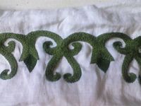 Hand embroidered trim based on the Viking archaeological finds. This piece can be seen on two Viking apron dresses. Cotton thread on linen.