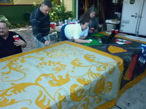 Painting the acanthus-leaf diapering. Pictured are (from left) Ingjaldr Inn Storrhogvvi, Giuseppe, Ceara, and Luciana.