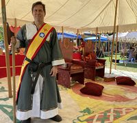 Lord Robert the Best standing as a member of the Barony of the Angels Guard at Angels Anniversary Summer A.S. LVII.