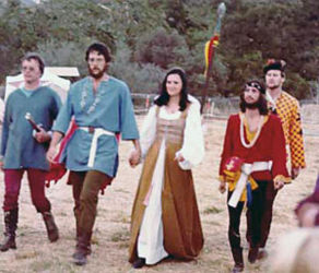 Taken 09/17/1977 as Martin and Neptha come forward to receive the victor's wreathes at the end of Coronet Tourney. (L-R): Viscount Sir Hugh the Undecided, Martin the Temperate, Neptha of Thebes, Sir Charles of Dublin, and Viscount Sir Morven of Carrick.