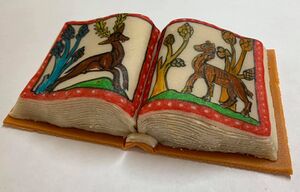A soltetie! Edible manuscript made with marzipan, cake and jam. Decorated with edible inks with images from Bestiary of the Second Family, England, second quarter of the thirteenth century. British Library, London, MS Royal 12 F XIII, 11&5/8 x 8&3/8 in. Folio 7: Leopard Pursuing a Stag
