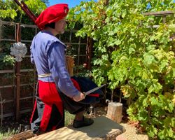 Sir Mons in 16th century Germanic garb in his medieval walled garden, 2023 (photo by Ann Hartl)