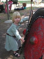Sofia playing with 5th Brigade shields. 2005 Photo by Beorn of the Northern Sea