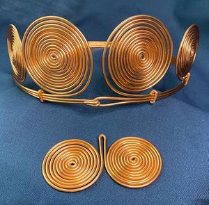 Recreations inspired by the Hallstatt diadem and spectacle pendant (ca. 1100 BCE).