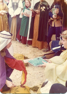 Flavia Beatrice Carmigniani giving a piece of polished malachite to Queen Carol. In background: in green: Alison von Markheim; Contribution by Brion of Bellatrix