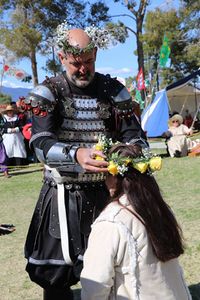 Prince Wilhelm placing a garland of roses on Princess Tsyra at March Crown 2019