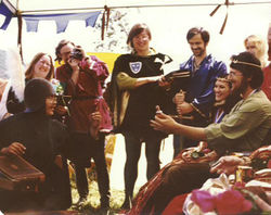 Martin and Neptha holding court as last Prince and Princess of Caid. From left to right: Cameron of Caladoon, Alison von Markheim, Nikolaj Zrogowacialy, Conrad von Regensburg, Jason Griffiths of Shadowhyrst, Gabrielle Nicole Devereaux, Neptha of Thebes, Martin the Temperate