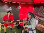 Mons wearing his Tudor coat based on images from “The Embarcation at Dover” playing Hurdy Gurdy with his friend, Montaigne (photo by Ann Hartl)