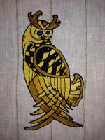 Hand embroidered Viking inspired Owl for Her Majesty Sigriðr in irska: Patch for Viking apron; split stitch; cotton thread on linen, attached to a linen apron. The design is inspired by her heraldry of a Gold owl with black herman spots.