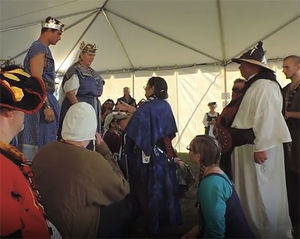 Qara Unegen Returning Baroness Ulrike the Franke's Crescent to Caid, to Agrippa and Bridget at Great Western War 2014