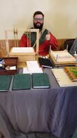 Sir Alsander winning populace choice at Calafia Winter Arts 2022 with his book binding display