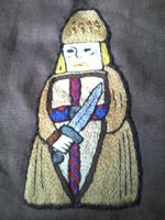 Embroidered Chess Piece - worn on son's parti style tunic; split stitch; cotton thread on linen.