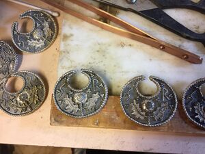 A collaboration modeled after Viking Lunula pendants. Megan sculpted the mold, polished the cast pieces, and applied patina. Metal casting completed by Gavin MacDhomhnuill and Adam Makandro