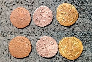 Yari coins: a gold one, a silver one, and the usual copper one, made using the dye that the late Master Peter of Dun Calma made in Yaroslav the Persistent's honor when he stepped down as Captain-general after six years
